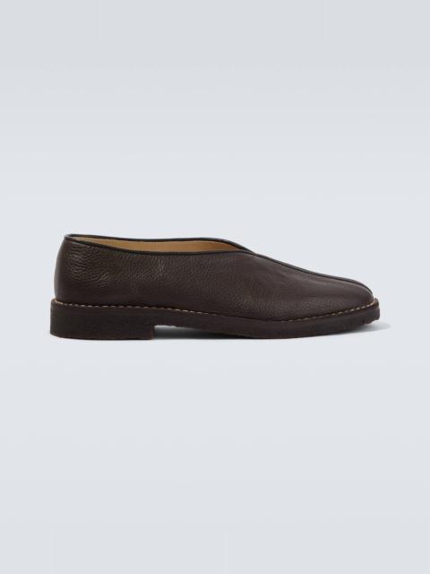 Piped leather slip-on shoes