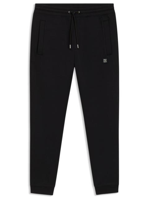 COTTON TRACKSUIT BOTTOMS WITH STACKED LOGO