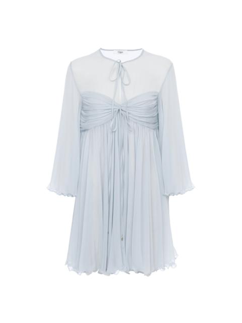 PLEATED MINI DRESS IN SILK MOUSSELINE