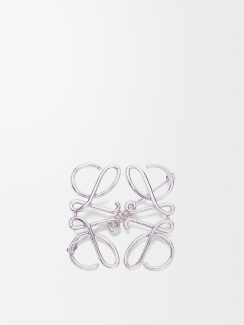 Anagram brooch in metal