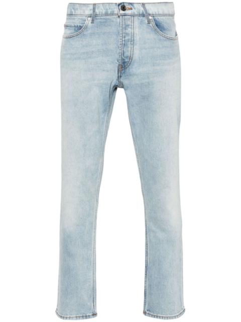 slim-leg cotton-blend jeans