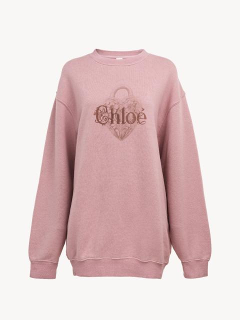 OVERSIZED LOGO SWEATER IN CHINÉ FLEECE