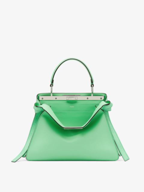 Iconic medium Peekaboo ISeeU bag, made of green leather with long knotted side laces, printed with a