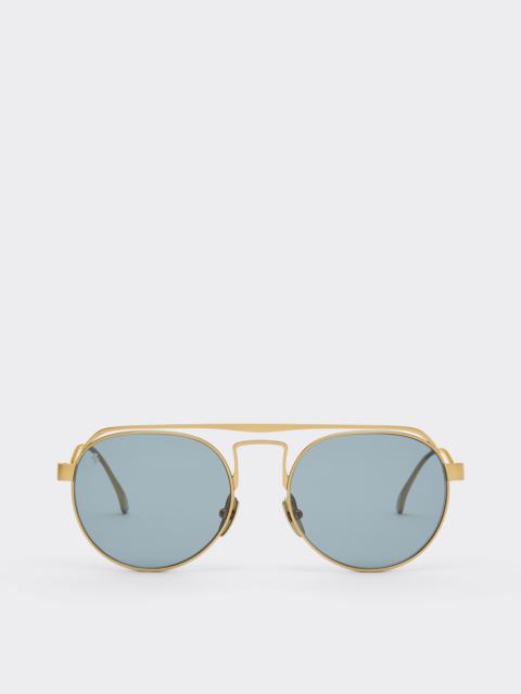 Ferrari sunglasses in matte goldtitanium with blue lenses
