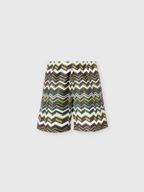Long swim shorts with irregular zigzag print