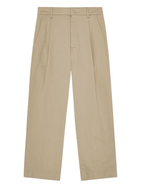 Relaxed-fit pleated trousers crafted from organic cotton with a lustrous satin finish.