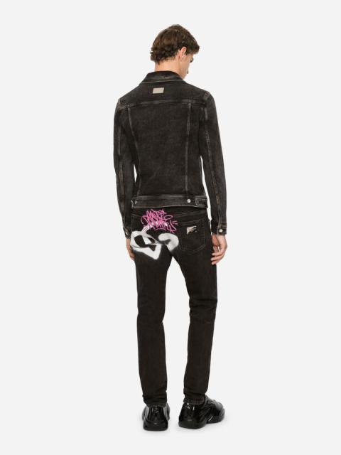 Black skinny jeans with spray-paint DG print