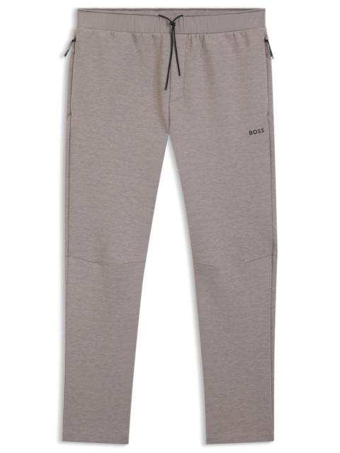 REFLECTIVE-DETAIL TRACKSUIT BOTTOMS IN A REGULAR FIT