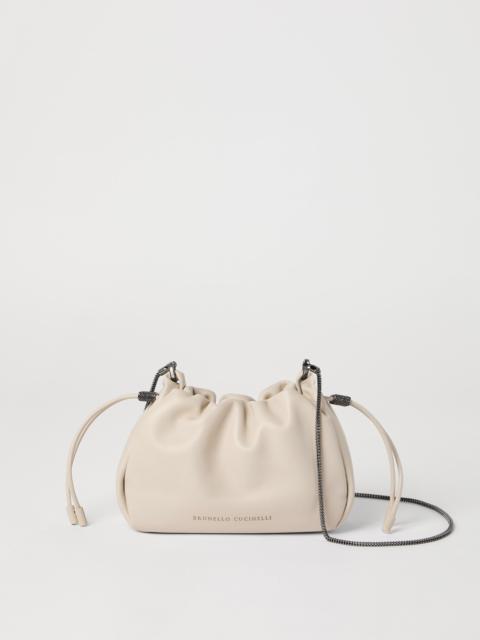 Mellow mini bucket bag in soft leather with precious chain