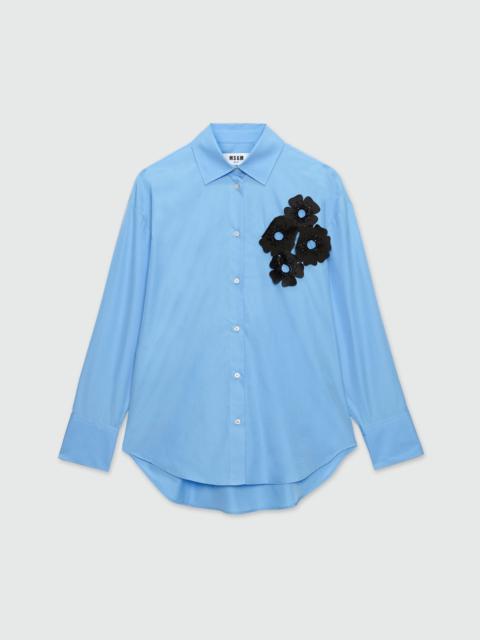 Light blue poplin shirt with floral applications