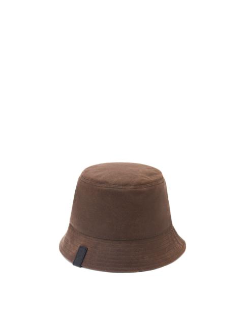 Reversible bucket hat in waxed canvas and tartan