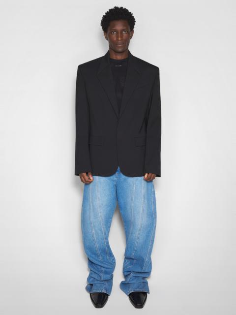 washed blue oversized spiral jeans