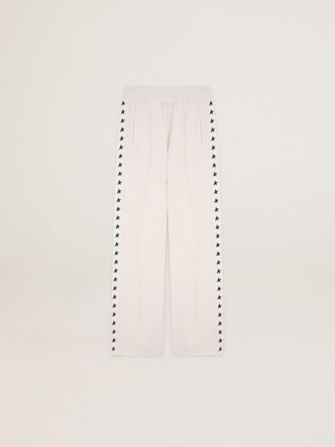 Women’s white joggers with stars on the sides