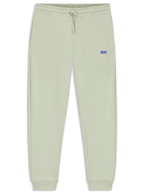 COTTON-TERRY SWEATPANTS WITH LOGO PATCH