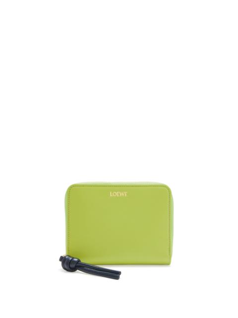 Knot compact zip around wallet in shiny nappa calfskin