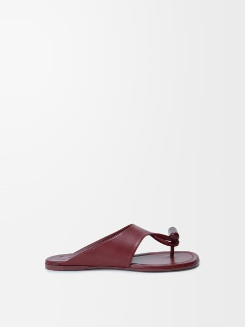 Toggle flat sandal in shiny smoot calfskin