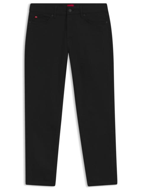 BLACK TAPERED-FIT JEANS IN THERMO-REGULATING DENIM