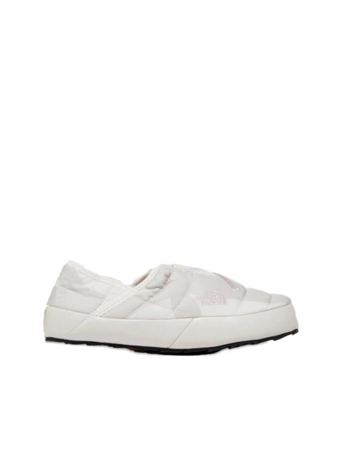 x KAWS Thermoball Traction slip-on sneakers