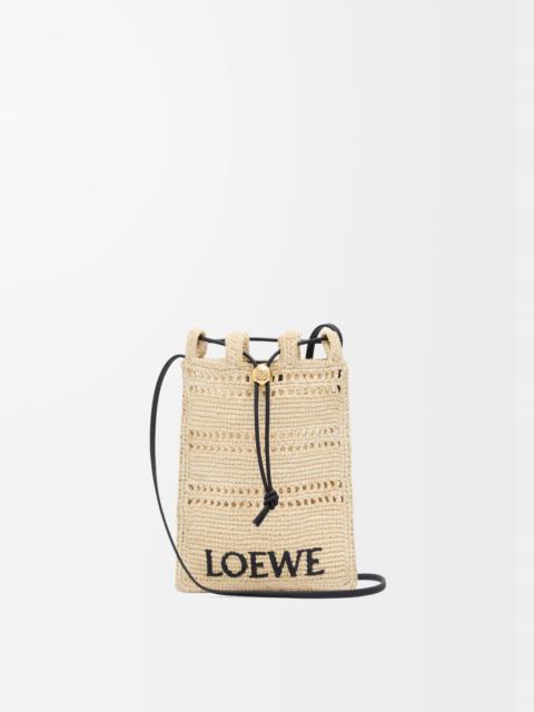 Drawstring pocket in raffia