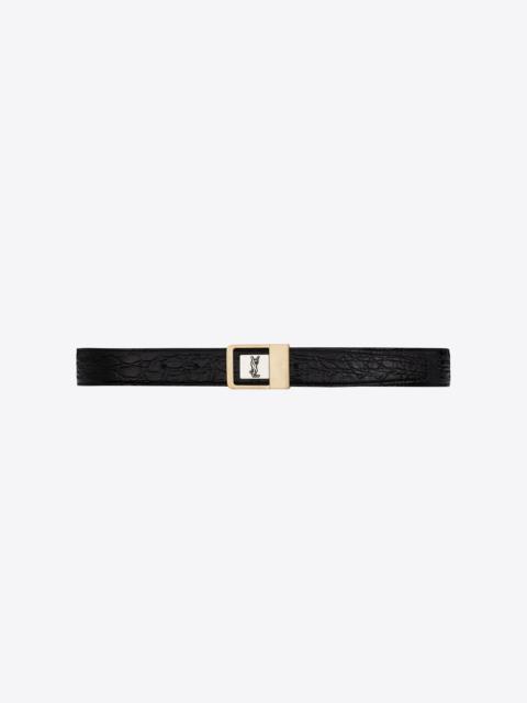 female buckle belt in crocodile-embossed leather
