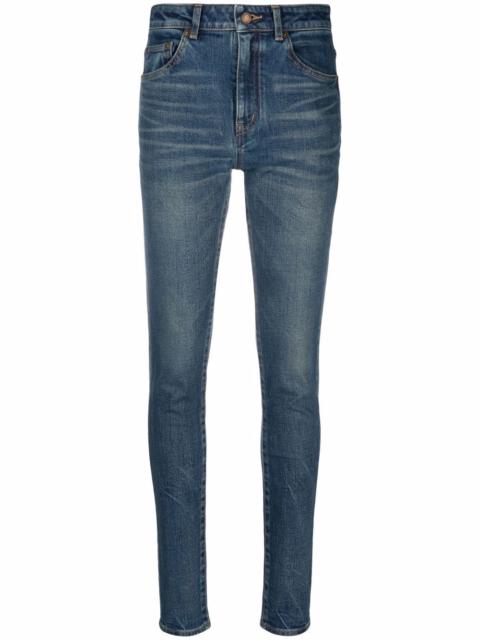 whiskered skinny jeans
