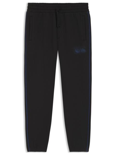 LOGO-ARTWORK TRACKSUIT BOTTOMS IN COTTON TERRY