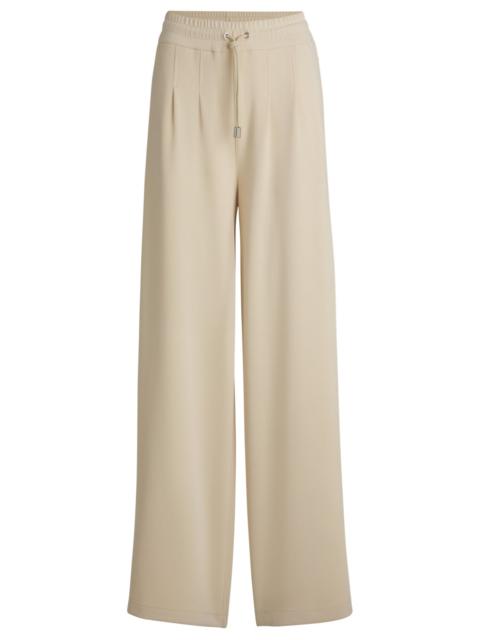WIDE-LEG TRACKSUIT BOTTOMS WITH PLEAT DETAILS