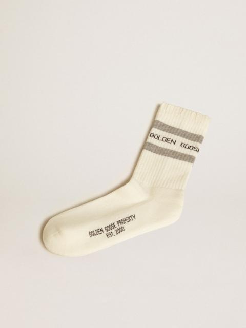White socks with distressed details and gray stripes
