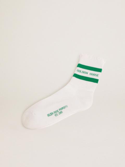 Cotton socks with distressed finishes, green stripes and logo