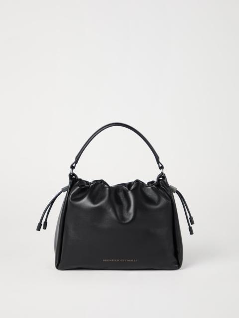 Mellow small bucket bag in soft leather with monili