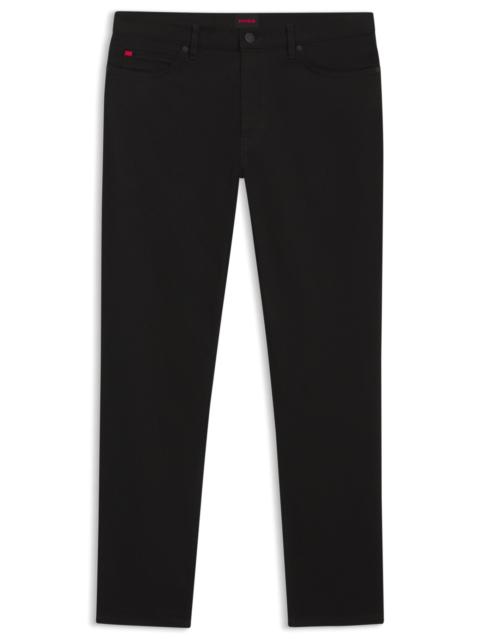 STAY-BLACK TAPERED-FIT JEANS IN STRETCH DENIM