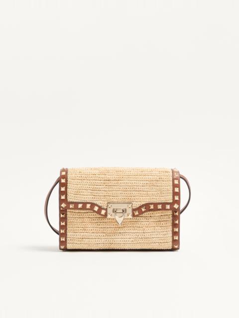 VALENTINO GARAVANI ROCKSTUD SMALL SHOULDER BAG IN RAFFIA