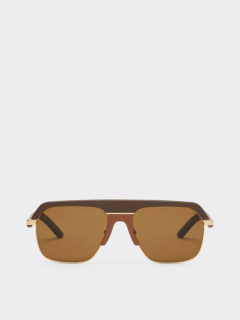 Ferrari sunglasses in matte gold metal with brown polarized lenses