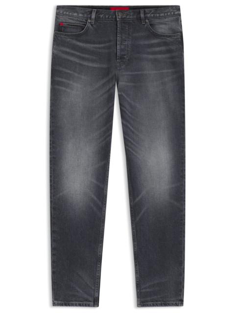 TAPERED-FIT JEANS IN USED-EFFECT GRAY DENIM