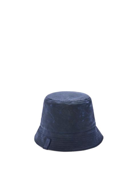 Reversible bucket hat in waxed canvas and tartan
