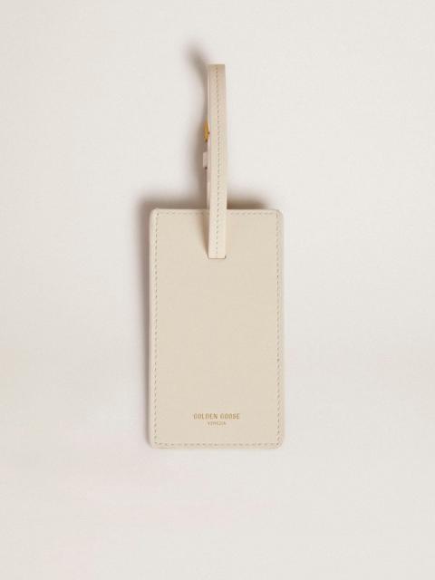 Worn white luggage tag
