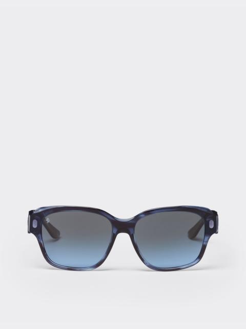 Ferrari sunglasses in striped blue acetate with polarised gradient blue lenses