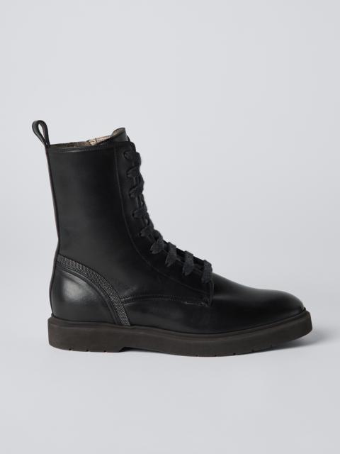 Calfskin boots with shiny contour