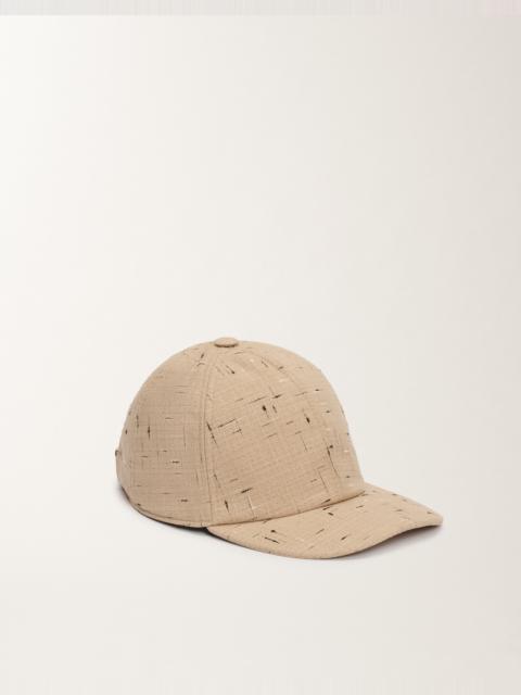 Baseball cap in buttoned tailoring
