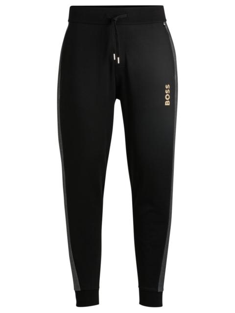 TRACKSUIT BOTTOMS WITH FOIL-PRINT LOGO