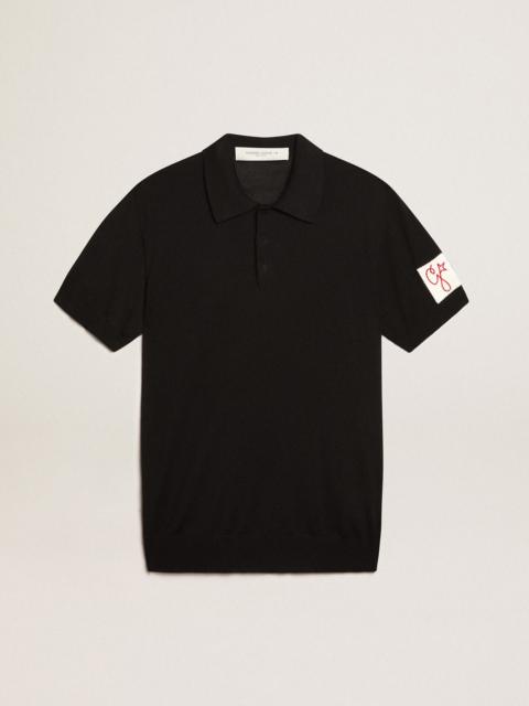 Men’s short-sleeved polo shirt in black merino wool