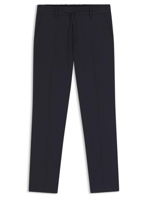 PATTERNED SLIM-FIT TROUSERS IN A WOOL BLEND