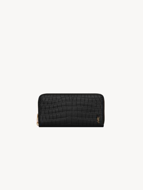 TINY CASSANDRE ZIP-AROUND WALLET IN CROCODILE-EMBOSSED MATTE LEATHER