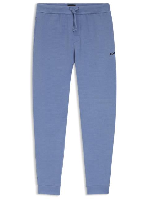 WAFFLE-STRUCTURE PYJAMA BOTTOMS IN A COTTON BLEND