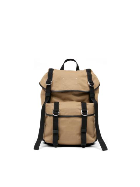 flap top strapy backpack