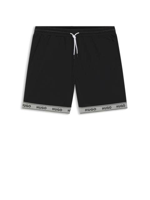 MESH SWIM SHORTS WITH JACQUARD LOGO TAPE