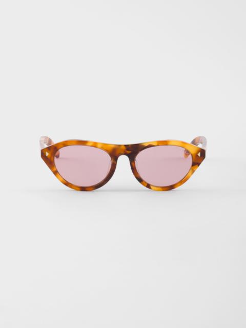 Prada sunglasses with the iconic metal plaque