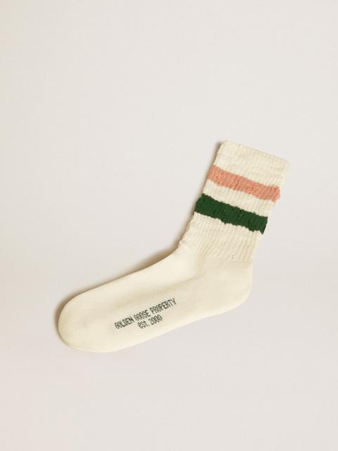 Worn-white socks with distressed details and pink and green stripes
