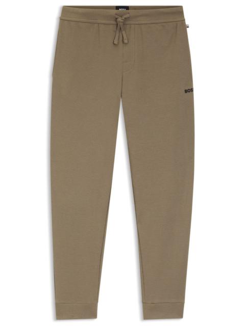 WAFFLE-STRUCTURE PYJAMA BOTTOMS IN A COTTON BLEND