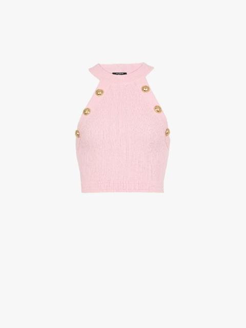 Cropped pale pink knit top with gold-tone buttons